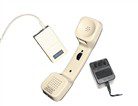 Retro telephone handset with adapters.